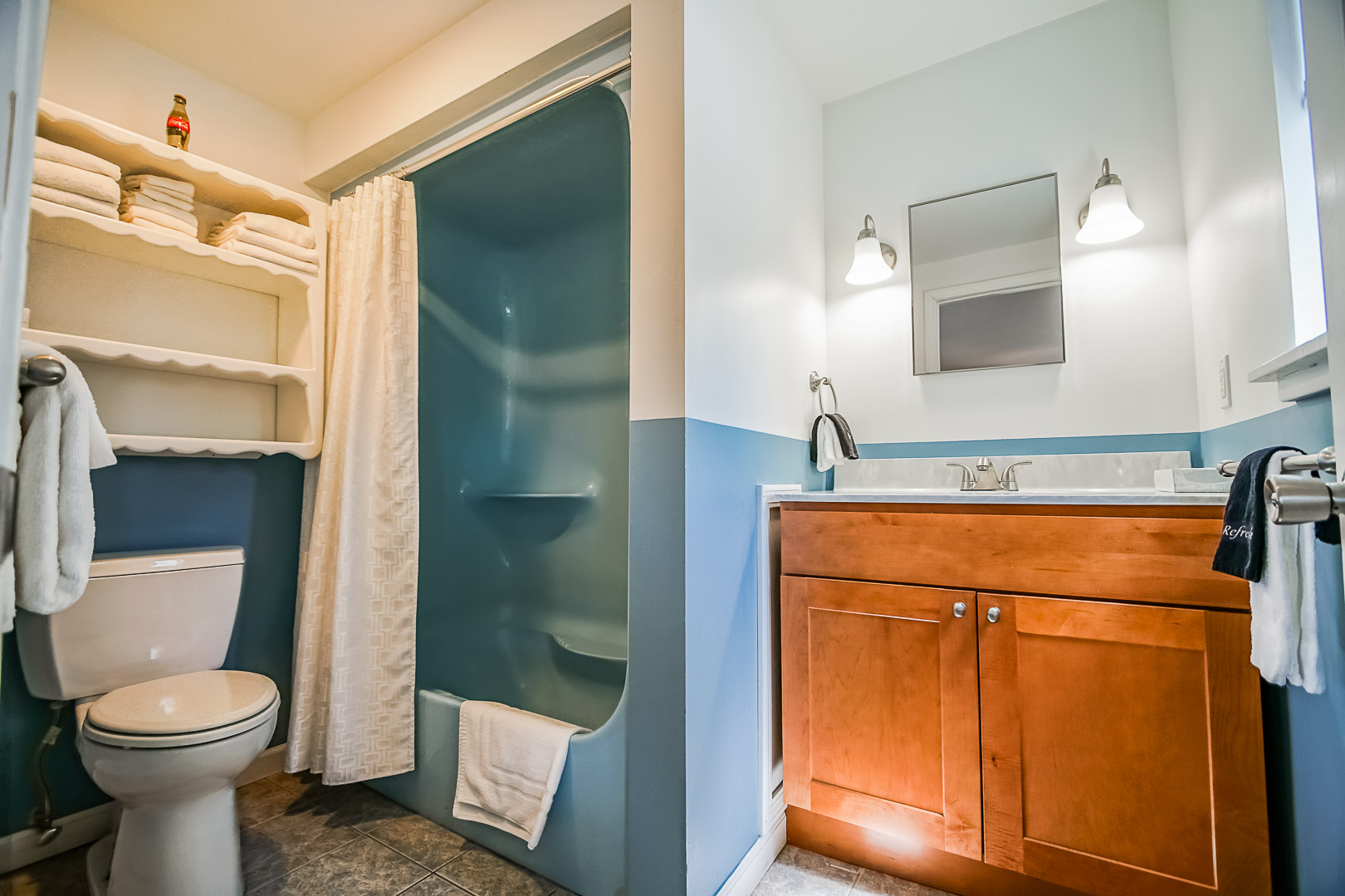 A cozy bathroom  at VRI's Neptune House Resort in Rhode Island.